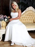 Slutty Lana is wearing a wedding dress white stockins, high heels and masturbating