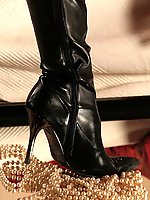 Horny police woman in uniform, black pantyhose and high heeled boots