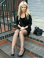 Gorgeous blonde in high heels and grey pantyhose