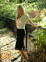 Blonde MILF is teasing in a very sexy pair of white stilettos and nylons