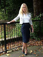 Blonde Milf teasing outdoors in a lovely pair of blue high heels and nylons