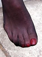 Mature lady flashing her feet in stockings in public