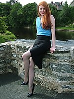 Cute redhead MILF flashing her shiny stilettos and pantyhose