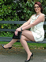 This horny MILF loves to pose outdoors in her pantyhose and high heels