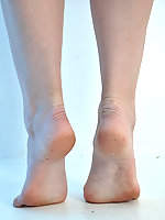 Nylon Jane shows off her very sexy feet in nylons on this foot play shoot.
