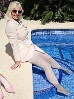 Mature woman in wet stockings spreads legs