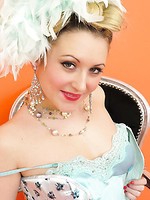 Saucy blonde showgirl in corset and white fishnet stockings knows how to tease.